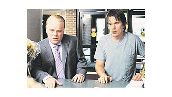 ámbito.com | Philip SeymourHoffman yEthan Hawke,los hermanoscomplicadosen un delito en«Antes que eldiablo sepaque estásmuerto».