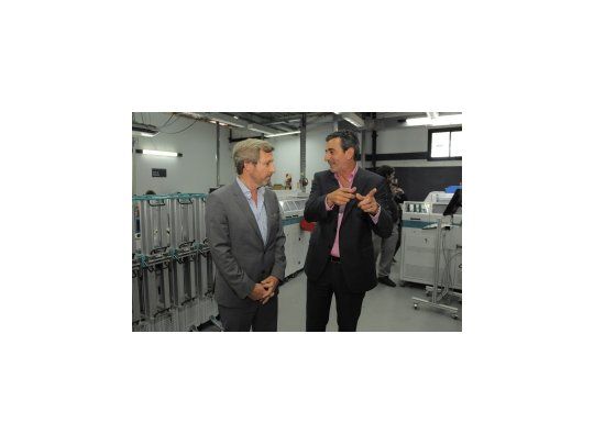 Rogelio Frigerio y Florencio Randazzo.