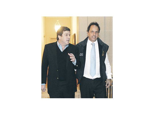 Daniel Scioli y Gabriel Mariotto durante el primer encuentro luego de que Cristina de Kirchner le anunció al gobernador que el lomense sería su compañero de fórmula.