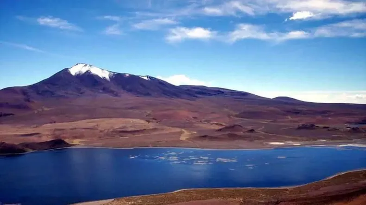A lagoon, surrounded by the mountains of the Andes Mountains. A lagoon, surrounded by the mountains of the Andes Mountains.