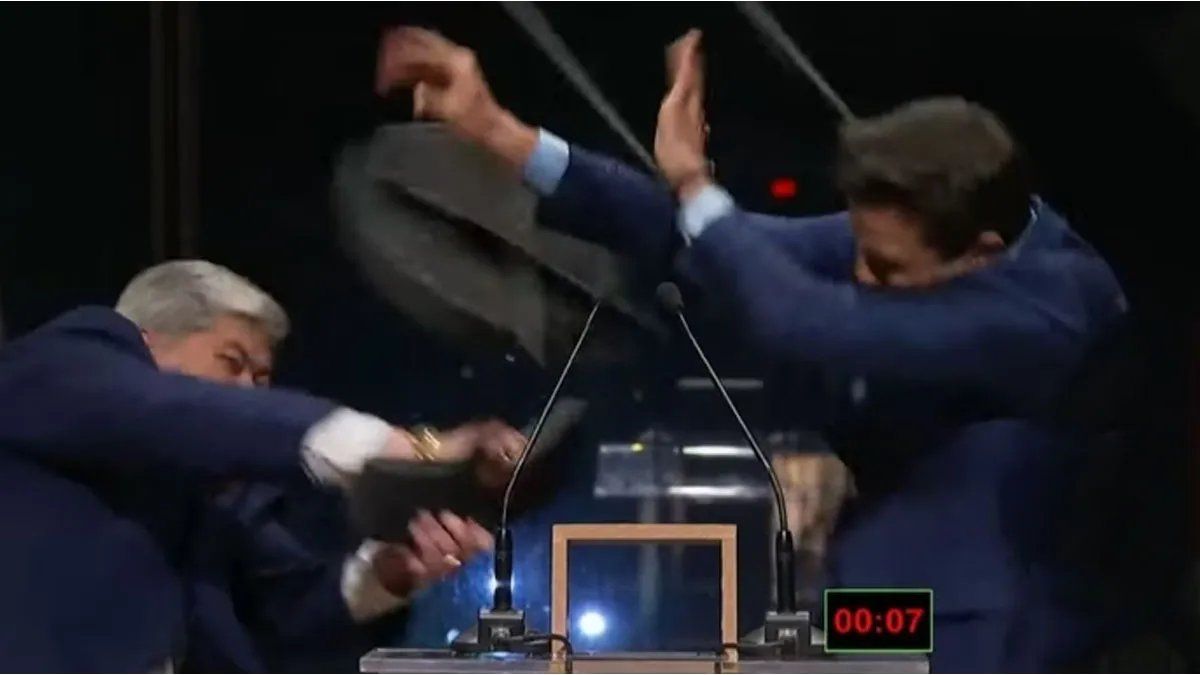 A candidate hit his rival in the head with a chair during a debate in Brazil