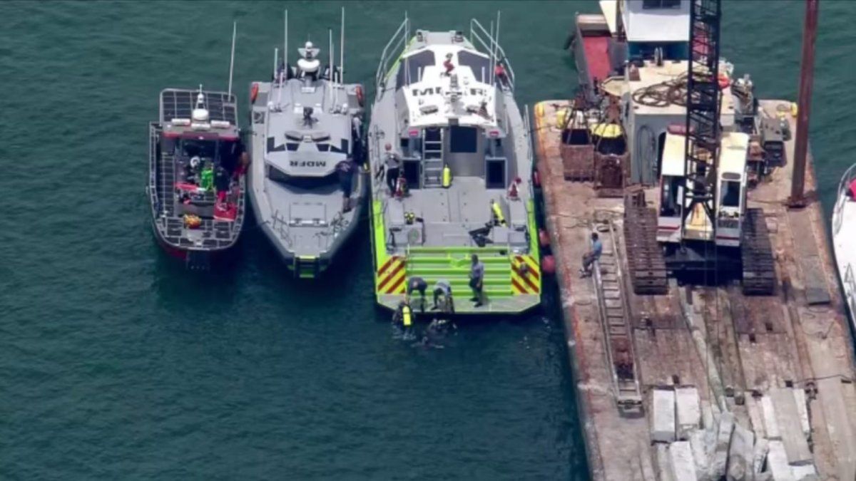 Two children died after a clash between a barge and a sailboat