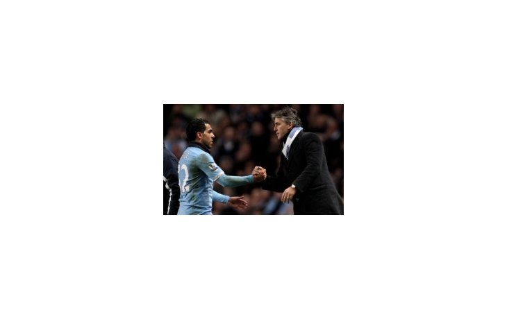 Carlos Tevez y Roberto Mancini