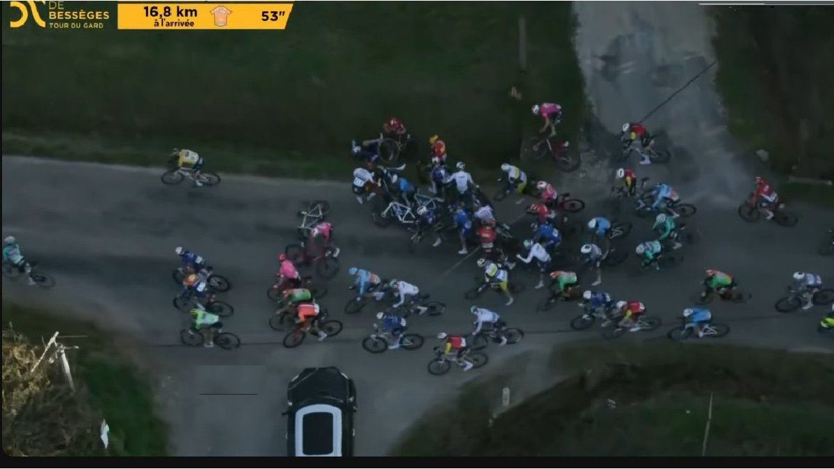 A car was mistakenly in a cycling race, it came out in reverse and avoided a tragedy