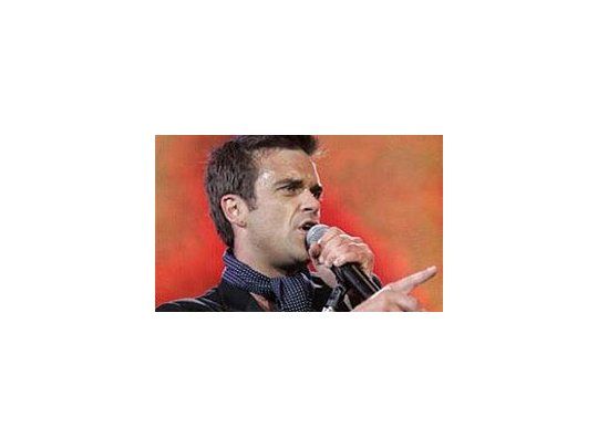 Williams volvió a alentar rumores de reunión con su ex grupo, Take That.