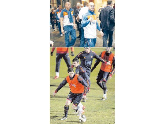 La vuelta de Wesley Sneijder a la concentración de Holanda después del día libre. Hoy empezarán a preparar la final del domingo. ; España no descansó y, aunque los que trabajaron más fuerte fueron los suplentes, hubo una dura sesión de entrenamiento. En la foto, Fernando Torres y Cesc Fábregas.