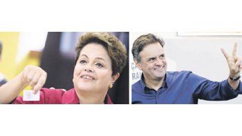 ámbito.com | Al votar, la presidenta Rousseff (izquierda) dijo saber que la elección se definiría en la segunda vuelta y se mostró preparada para el nuevo round. Su rival, el candidato del mercado, Aécio Neves (derecha), inició ayer mismo la campaña  por el apoyo de l
