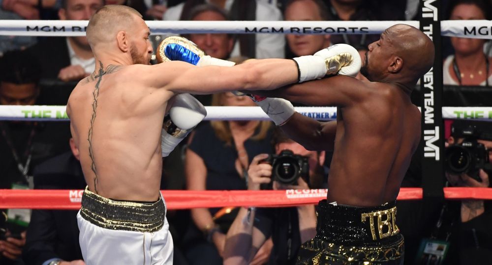 Los primeros rounds fueron parejos entre el pugilista norteamericano y el campeón de artes marciales mixtas