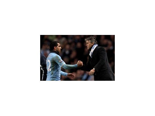 Carlos Tevez y Roberto Mancini