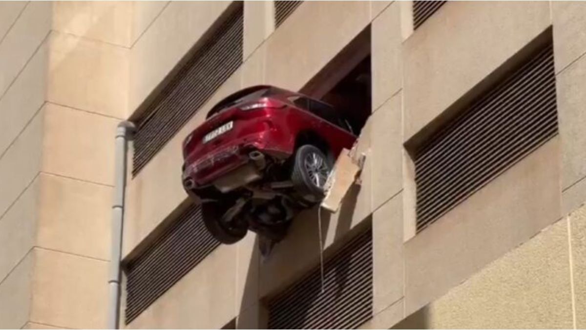 A driver miscalculated the reverse gear and left her car hanging from a third floor