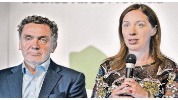 Alivio. Vidal -ayer con su secretario de Derechos Humanos, Santiago Cantón- cerró 2017 con un acuerdo que engrosará las arcas locales.