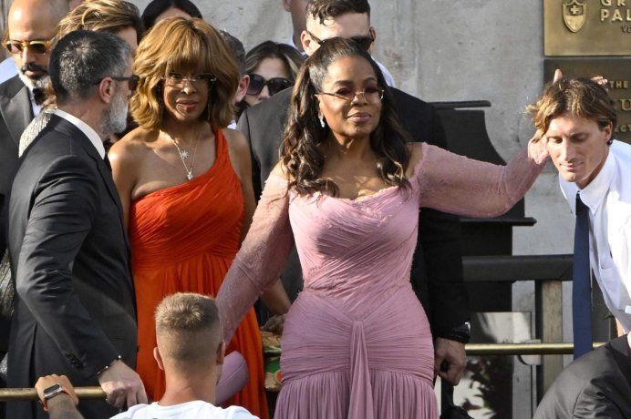 Oprah Winfrey on a worn pink dress. Oprah Winfrey on a worn pink dress.