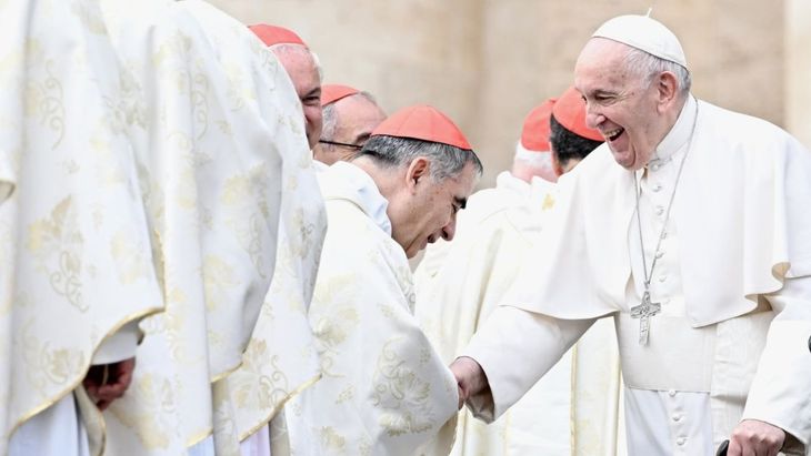 Cardinal Angelo Becciu and Pope Francis.