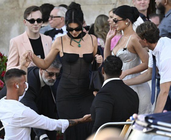 Kendall and Kylie Jenner surrounded by other guests. Kendall and Kylie Jenner surrounded by other guests.