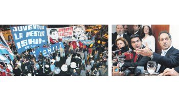 ámbito.com | Daniel Scioli y Jorge Capitanich, ayer durante la conferencia poscumbre. Afuera, arrimados por Mario Ishii, hacían ruido militantes de La Néstor.