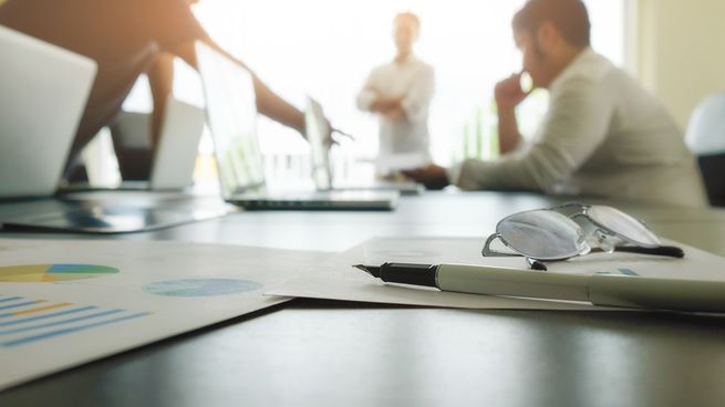 business-concept-with-copy-space-office-desk-table-with-pen-focus-and-analysis-chart-computer-notebook-cup-of-coffee-on-desk-vintage-tone-retro-filter-selective-focus.jpg