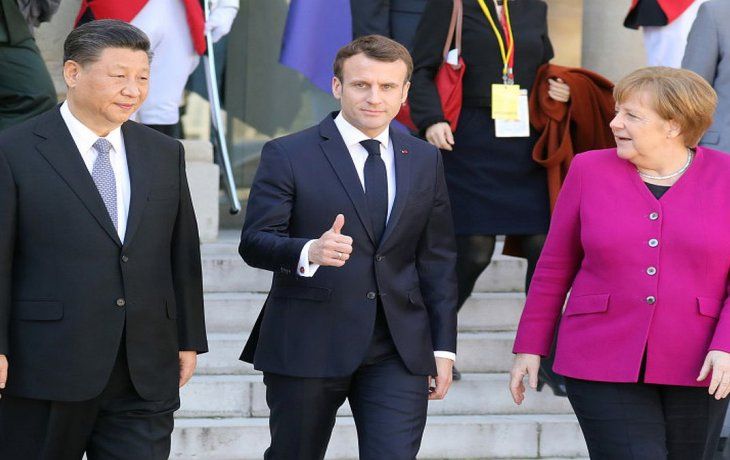 El presidente chino Xi Jinping, junto a su par francés Emmanuel Macron y la alemana Angela Merkel.