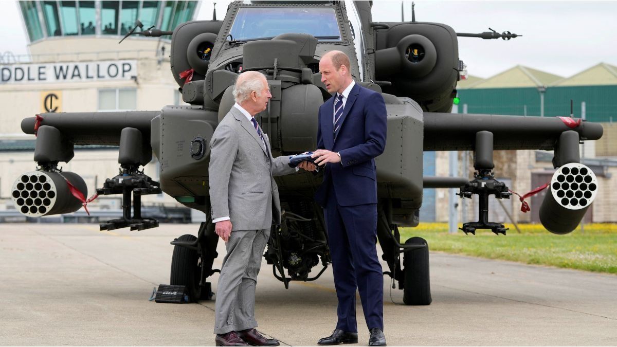King Charles of England presents a military title to his son William in a rare joint appearance