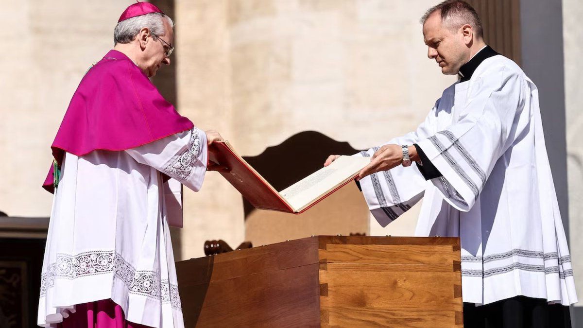 What represents the book on the coffin during the ceremony