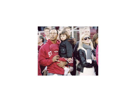 Una postal familiar: Tiger Woods con su hija Sam y su esposa Elin.