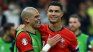 Legends. Pepe and Ronaldo smile after Portugal's elimination of Slovenia. 