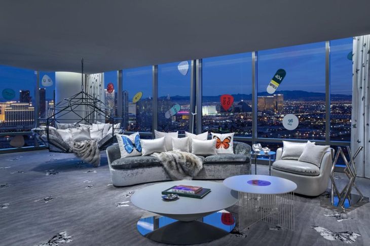 The room features floor-to-ceiling windows offering stunning views of the Las Vegas Strip. The room features floor-to-ceiling windows offering stunning views of the Las Vegas Strip.