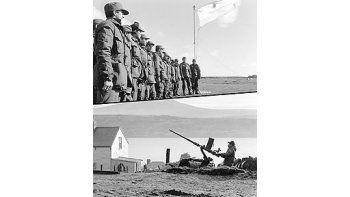 ámbito.com | Los soldados argentinos dispuestos para enfrentar a los ingleses. Primero saludando a laBandera en los primeros días del desembarco en abril de 1982. Espera con ametralladora unposible ataque inglés.