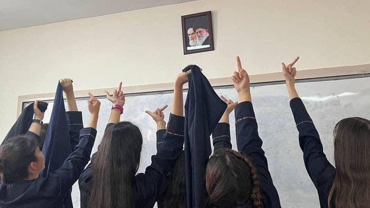 students take off the veil and shout death to the dictator