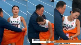 La atleta Lee Su-min y su entrenador al terminar la carrera.&nbsp;