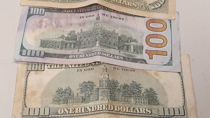 100 dollar bill with stains