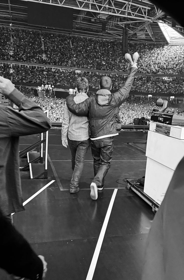 The photo for the story: the gallagher brothers hugged seconds before the beginning. The photo for the story: the gallagher brothers hugged seconds before the beginning.