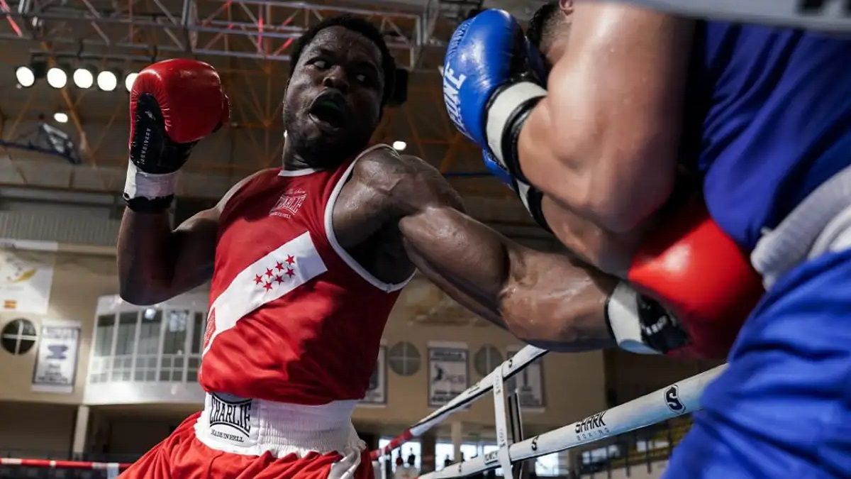 He is Cameroonian, an Olympic boxer and his name is Bocas Junior