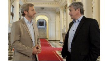 Rogelio Frigerio y Ricardo Delgado.