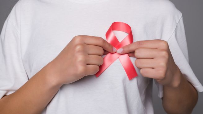 world-breast-cancer-day-concept-health-care-woman-wore-white-t-shirt-with-pink-ribbon-for-awareness-symbolic-bow-color-raising-on-people-living-with-women-s-breast-tumor-illness.jpg