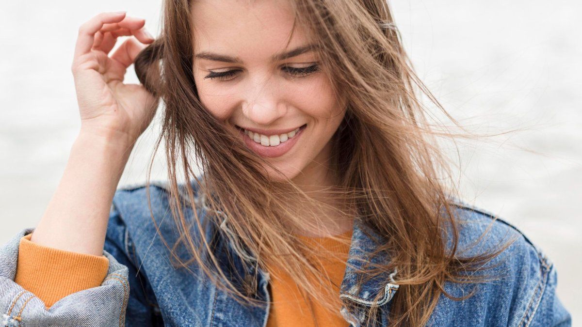 What does it mean to touch my hair while talking to people, according to psychology