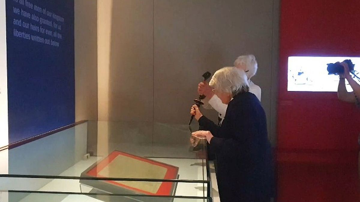 Two old women tried with a hammer to break the box protecting the Magna Carta