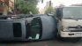 A car that was being transported on a crane fell on its side and overturned. A car that was being transported on a crane fell on its side and overturned.