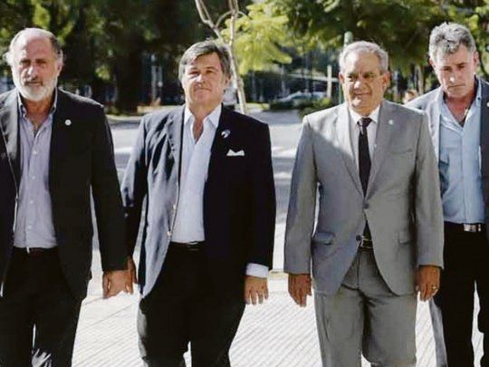 tiempo pasado. Jorge Chemes, Daniel Pelegrina, Carlos Iannizzotto y Carlos Achetoni, en una de sus últimas apariciones en conjunto, cuando fueron convocados a una reunión en el Ministerio de Agricultura.