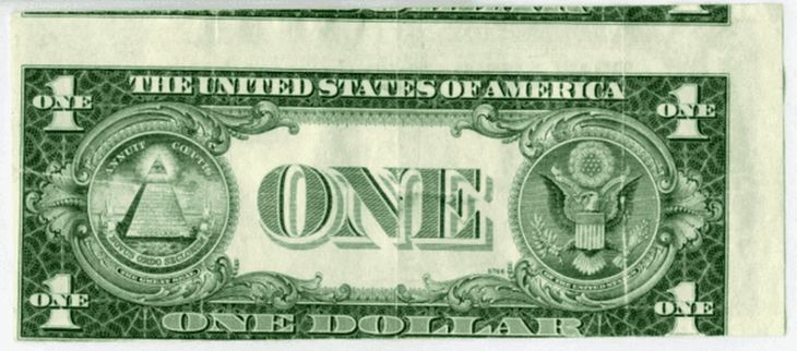 El billete de u$s1 que, si se lo ve bien, su parte impresa en color verde está desalineada del resto del papel.