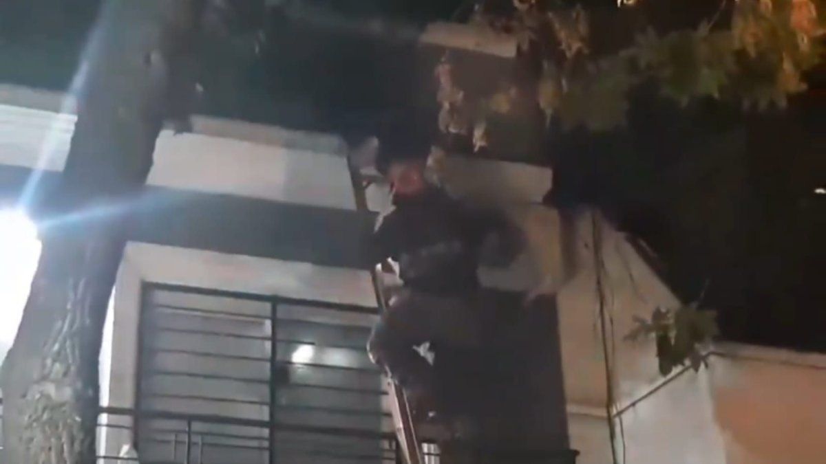 A baby was thrown to be saved from the flames