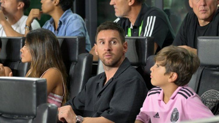 Messi watching the game from the box Messi watching the game from the box