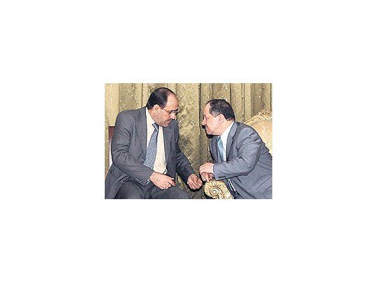 El primer ministro iraquí, Nuri al-Maliki, y el líder kurdo Masud Barzani. La salida de los ministrossunitas de la coalición gobernante provoca una peligrosa parálisis política.