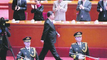 NUEVA ERA. Xi Jinping fue recibido con una ovación en el Palacio del Pueblo en Pekín. El presidente prometió que el país seguirá promoviendo cambios, aunque no especificó cuáles.