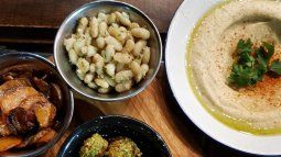 Hummus and accompaniments are a must in this cuisine. Hummus and accompaniments are a must in this cuisine.