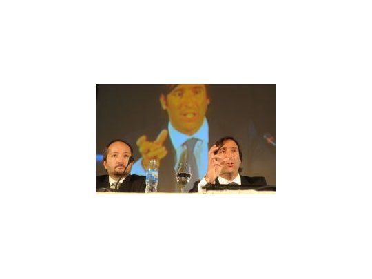 Superintendente de Seguros, Juan Buontempo, con el ministro de Economía Hernán Lorenzino.