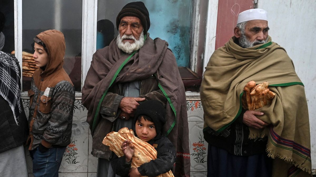 Hungry Afghans look for a piece of bread in Kabul to survive