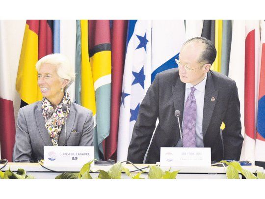 Pareja. Christine Lagarde (FMI) y Jim Yong Kim (BM), en cumbre conjunta.