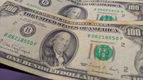 Billetes de 100 dólares cara chica manchados. Solían ser rechazados o comprados a menor valor.