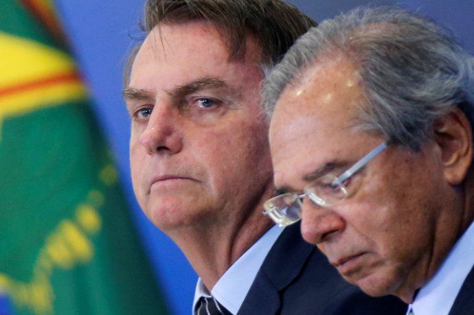 El presidente de Brasil, Jair Bolsonaro, y su superministro, Paulo Guedes.