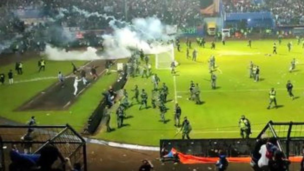 at least 129 dead in a pitched battle after a football match